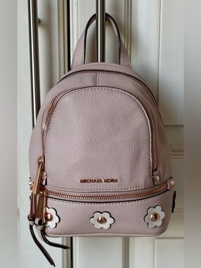 Michael Kors Rhea Blush Pink Pebbled Leather Mini Backpack with Floral Accents